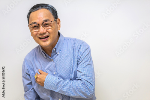 Senior asian adult elderly man with chest pain suffering from heart attack, health and medical, heart health, heart attack, world heart day, cardiovascular disease.insurance and hospital concept © Art_Photo