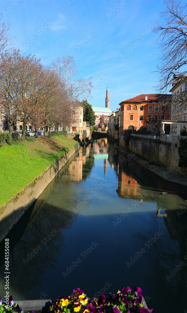 views of the historic center of Vicenza and the river called Retrone with the high Tower of the Palladian Basilica
