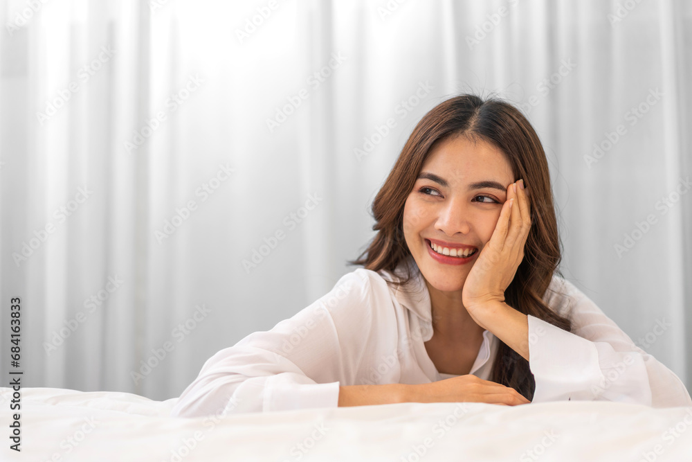 Portrait of smiling beautiful pretty asian woman clean fresh healthy white skin posing smile in pajamas white clothes, skincare, lady, model, cosmetic, fashion.Girl relax, enjoy at home.asia beauty Portrait of smiling beautiful pretty asian woman clean fresh healthy white skin posing smile in pajamas white clothes, skincare, lady, model, cosmetic, fashion.Girl relax, enjoy at home.asia beauty
