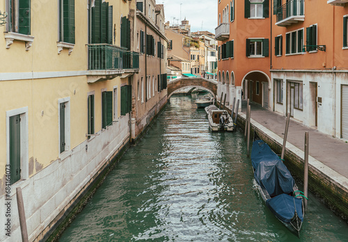 Channel in Venice - boat and old town houses