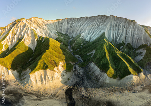 Russia, Kuril Islands, Iturup Island, White rocks on the coast of the Sea of Okhotsk. Aerial view. photo