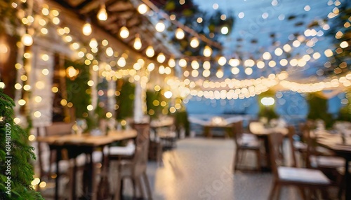 blurred background of restaurant with abstract bokeh light lights decoration party event festival holiday blur background outdoor string lights digital ai © Enzo