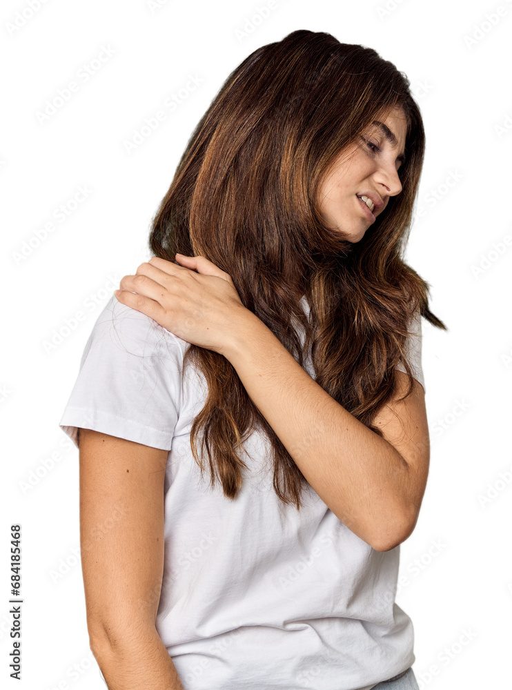 Young Caucasian woman in studio setting having a shoulder pain. Young Caucasian woman in studio setting having a shoulder pain.