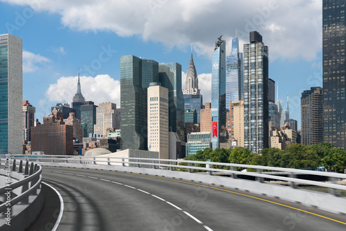 Empty urban asphalt road exterior with city buildings background. New modern highway concrete construction. Concept of way to success. Transportation logistic industry fast delivery. New York. USA. © VideoFlow