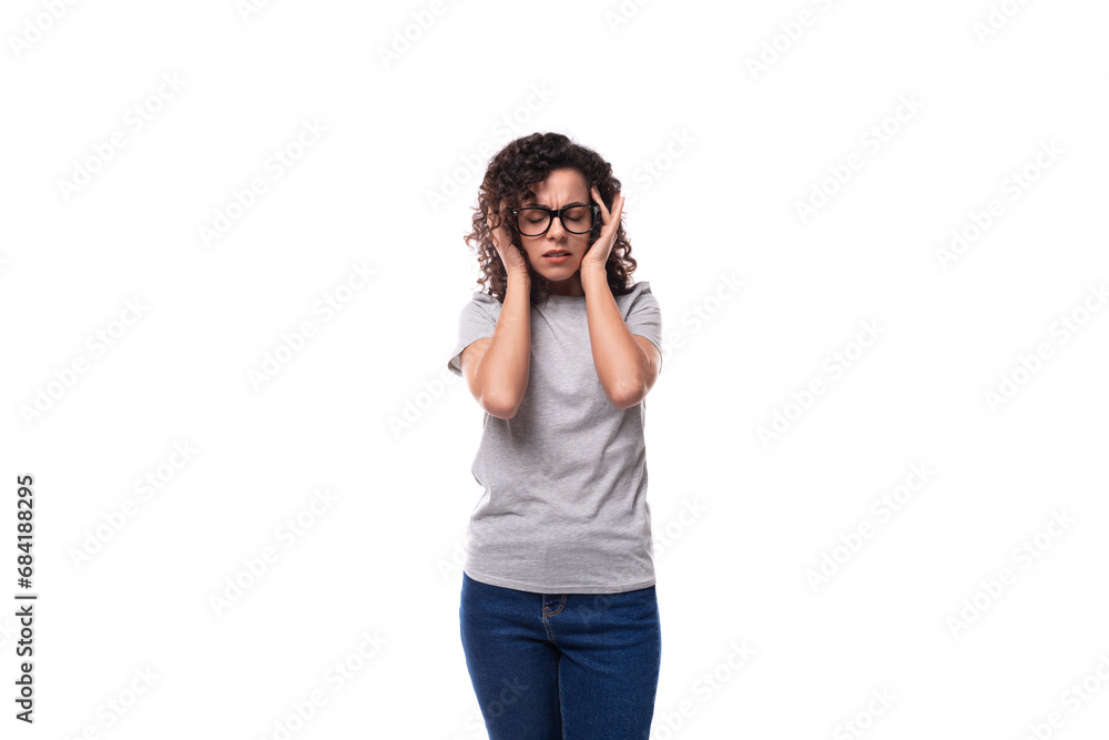 young charming slim 30 year old caucasian woman with curly black hair is trying to concentrate young charming slim 30 year old caucasian woman with curly black hair is trying to concentrate