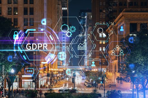Chicago downtown area city view and Millennium Park area, night time, Illinois, USA. Skyscrapers of financial district. GDPR hologram, concept of data protection regulation and privacy for individuals photo