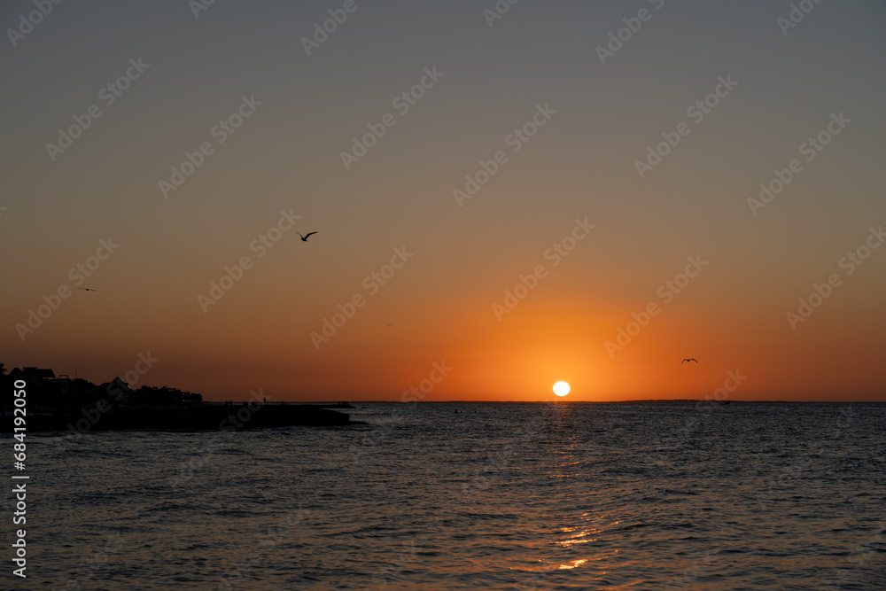 Beautiful sunset over the sea from Holbox, Mexico