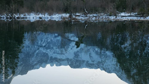 Refelctions on a Mountain Lake in Winter in Snowy Austria photo
