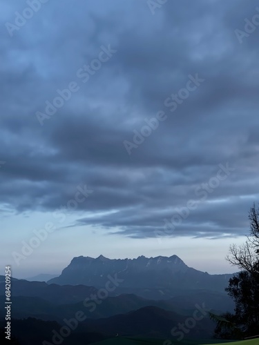 In the evening  Doi Luang Chiang Dao is covered with a thick layer of clouds overhead