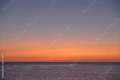 Background with sea on the sunset and Venus star, space for text
