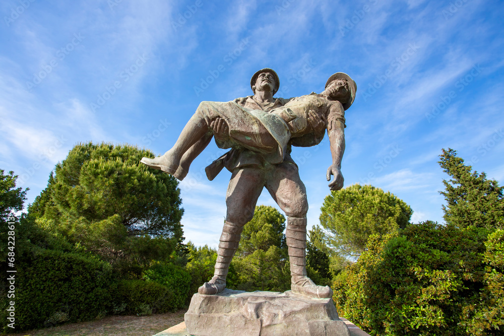 Canakkale / Turkey, May 26, 2019 / Monument of a Turkish soldier carrying wounded Anzac soldier at Canakkale (Dardanelles) Martyrs' Memorial, Turkey. - obrazy, fototapety, plakaty 