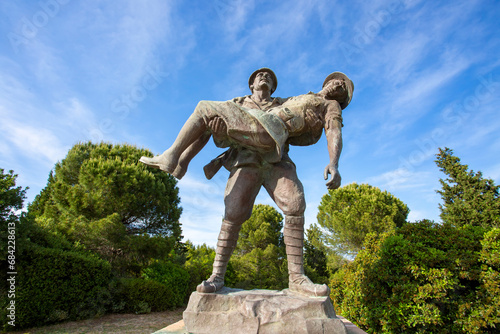 Canakkale / Turkey, May 26, 2019 / Monument of a Turkish soldier carrying wounded Anzac soldier at Canakkale (Dardanelles) Martyrs' Memorial, Turkey. photo