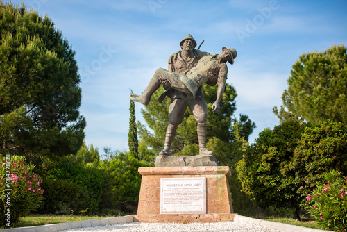 Canakkale / Turkey, May 26, 2019 / Monument of a Turkish soldier carrying wounded Anzac soldier at Canakkale (Dardanelles) Martyrs' Memorial, Turkey. photo