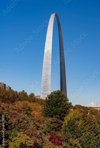 View across green planting of Gateway arch park to the Gateway Arch in downtown St Louis Missouri
