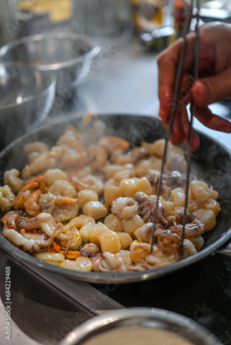 fresh seafood fried in a frying pan