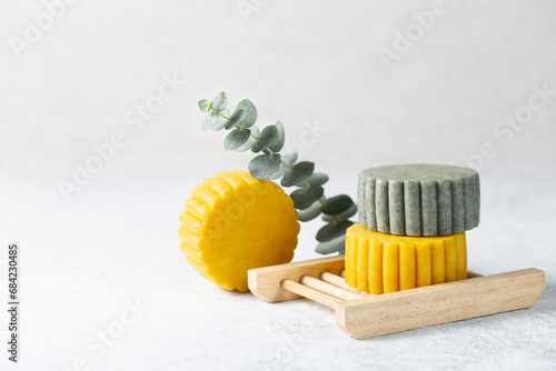 Bilde på lerret Solid handmade shampoo bars on soap tray on light background