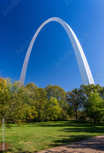 View across green lawn of National Park to Gateway Arch from Basilica of Saint Louis in St Louis Missouri