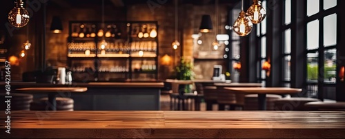 Elegant interior ambiance. Vintage inspired blurred background featuring dimly lit dining space with empty wooden table cozy chairs and subtle bokeh lights ideal for cafe and restaurant concepts © Wuttichai