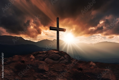 Cross on the rock with dramatic sunset sky background. Christian concept.