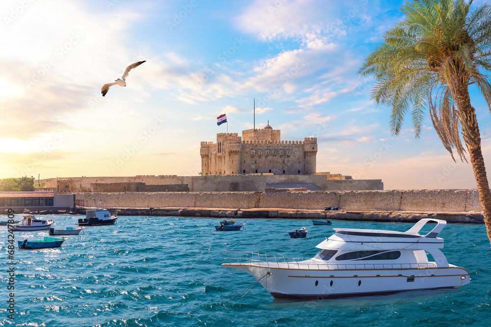 Boat in the Mediterranean in front of Citadel of Qaitbay, Alexandria, Egypt
