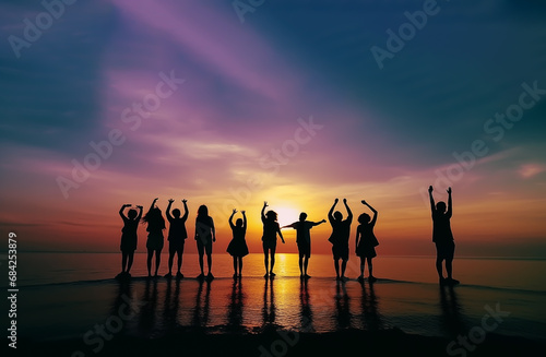 Silhouette of People Dancing On Beach. Happy friends having fun on sea beach in tropical. Bitch barty. Silhouette of group of people at sunset on beach party. Travel and Celebration summer vacation.