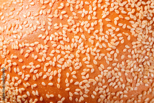 Place a sesame-covered patty inside a bun.