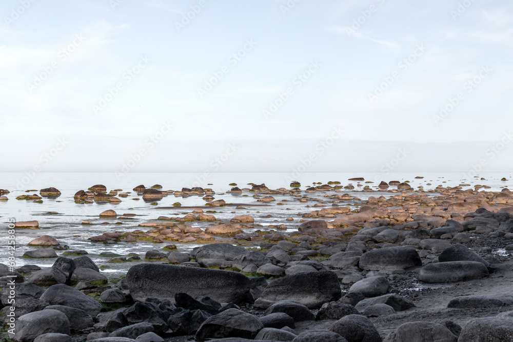 rocky sea beach with many big and small ones rocky sea beach with many big and small ones