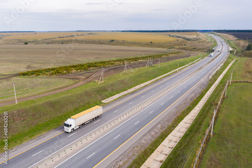 Trucks with trailers on the highway. Aerial view