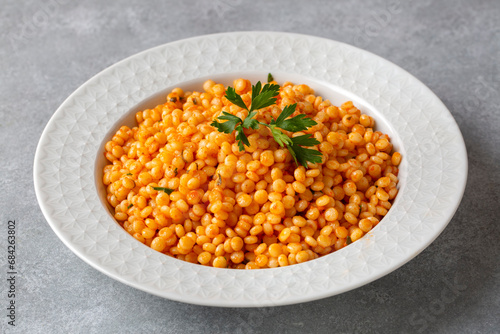 Couscous pilaf with tomatoes. Turkish name; domatesli kuskus pilavi photo