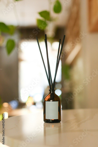 Empty-Label Diffuser Bottle with Wooden Sticks for Home, Featuring Organic Essential Oil - Stylish Black Hue on a Modern Background