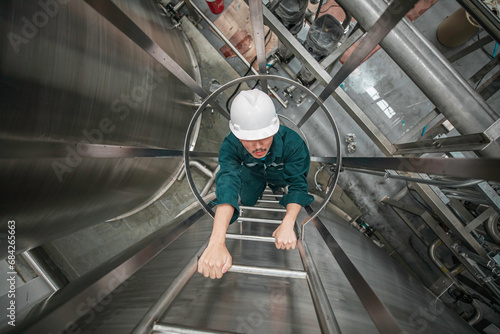 The male worker up the ladder is for inspection stainless steel tank chemical.