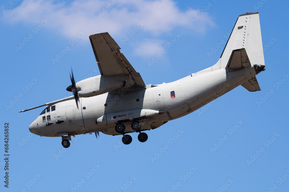 Untitled military transport plane at air base. Airport and airfield. Air force and army flight operation. Aviation and aircraft. Air lift. Military industry. Fly and flying. Untitled military transport plane at air base. Airport and airfield. Air force and army flight operation. Aviation and aircraft. Air lift. Military industry. Fly and flying.