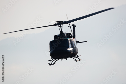 Untitled military helicopter at air base. Air force and army flight transportation. Aviation and rotorcraft. Transport and airlift. Military industry. Fly and flying.