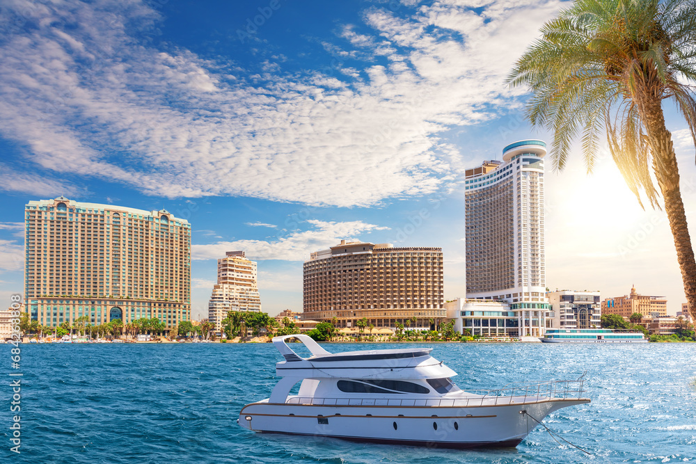Fancy boat in the Nile by elite buildings of Cairo, Egypt