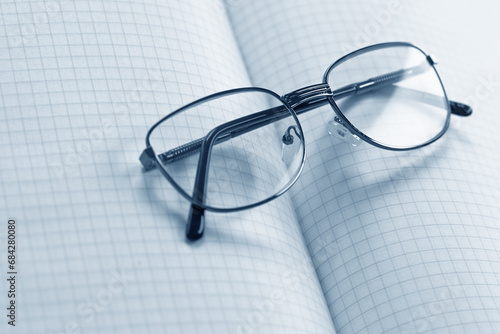 Glasses on the table with documents