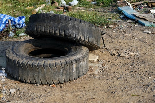 Old car tires left in the pile garbage area, environment concepts. 
