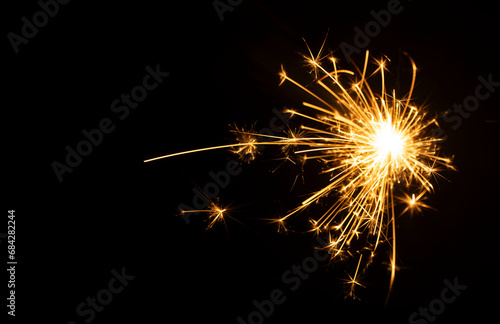 Close-up of sparks from fireworks, decorative lights, and decoration materials for celebrations, festivals, parties, birthdays, Christmas and New Year's celebrations.
