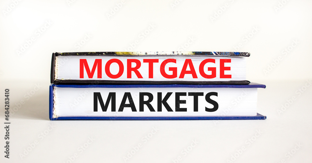 Mortgage markets symbol. Concept words Mortgage markets on beautiful books. Beautiful white table white background. Business mortgage markets concept. Copy space.