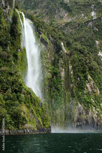 waterfall in the fjords of milford sound  new zealand