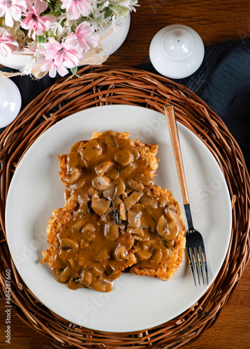 Fototapeta Naklejka Na Ścianę i Meble -  Sauerkraut pancakes /fuczka/ with mushroom sauce .