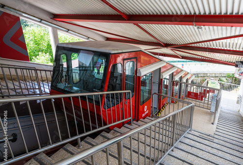 The Archanda funicular (cable car) in bright red color is a public transport that connects the town of Bilbao with the top of Mount Archanda, Bilbao, Basque country, Spain