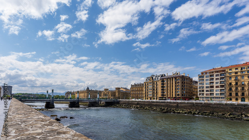 The River Urumea is a prominent feature in San Sebastian that divides the city and has various crossing points. The bridge in the photo is the Kursaal Bridge, Basque country, Spain