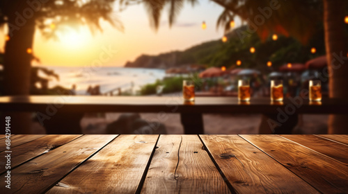 Concept of advertising image for product. Wooden table with blurred background located next to the beach. In the background and spectacular sunset
