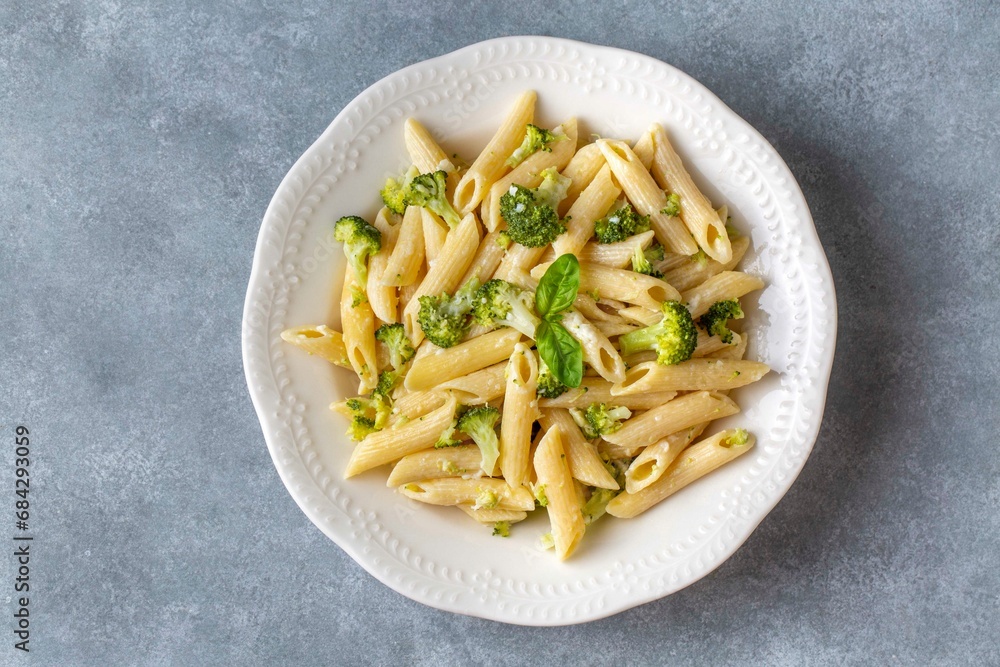 Creamy penne pasta with homemade broccoli and cheese. Turkish name; brokolili makarna Creamy penne pasta with homemade broccoli and cheese. Turkish name; brokolili makarna