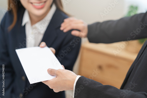 Good job Asian manager businesswoman giving financial reward in an envelope, business letter extra salary to company employee, woman worker office hand received premium bonus, getting cheque from boss