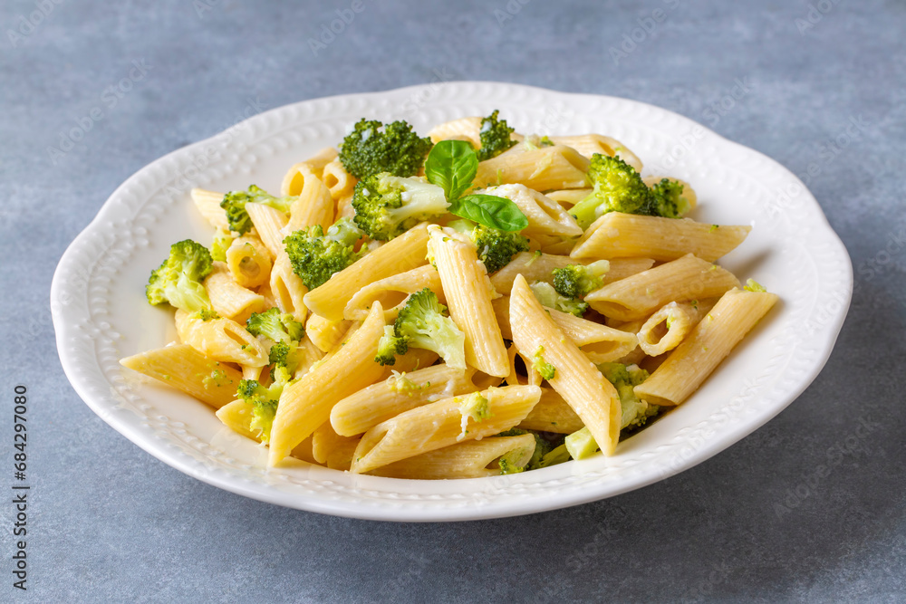 Creamy penne pasta with homemade broccoli and cheese. Turkish name; brokolili makarna Creamy penne pasta with homemade broccoli and cheese. Turkish name; brokolili makarna