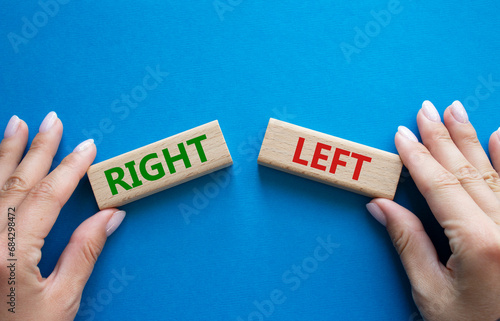 Right or Left symbol. Concept word Right or Left on wooden blocks. Businessman hand. Beautiful blue background. Business and Right or Left concept. Copy space