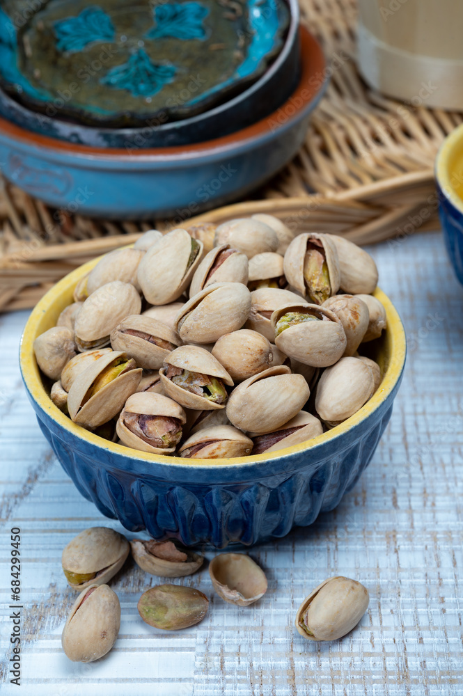 Roasted salty pistachio nuts, tasty healthy vegetarian snack food Roasted salty pistachio nuts, tasty healthy vegetarian snack food