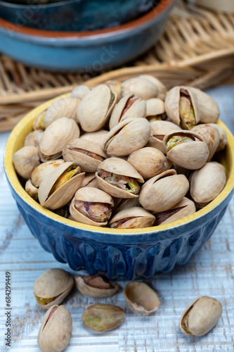 Roasted salty pistachio nuts, tasty healthy vegetarian snack food