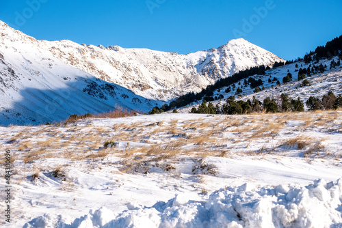 Snowy landscape on a cloudless day with pristine light in the winter in the Pyrenees mountains in France photo